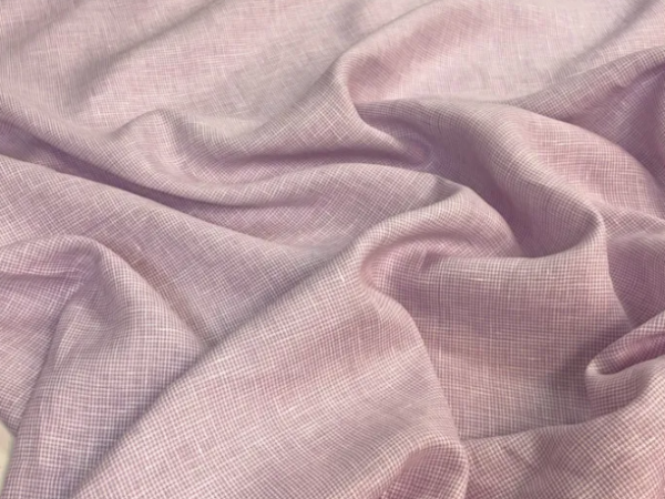 Qual o diferencial do tecido linho puro em vestidos elegantes?