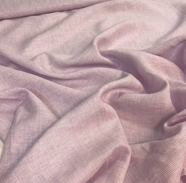 Qual o diferencial do tecido linho puro em vestidos elegantes?