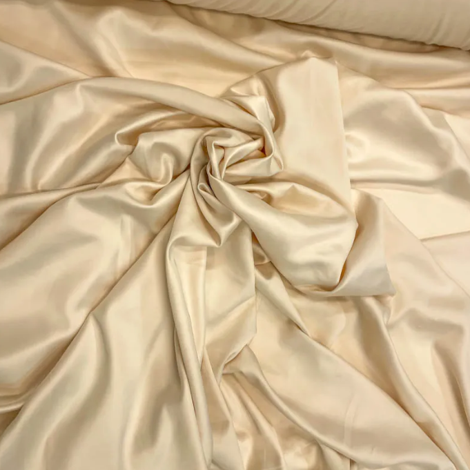 O que torna o tecido cetim bucol uma escolha superior para vestidos sofisticados?